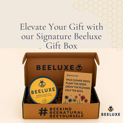 Beeluxe gift box with natural skin balm tin and wildflower seed packet.