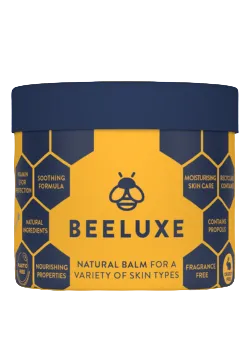 Beeluxe natural balm container with blue lid and yellow label on a yellow background