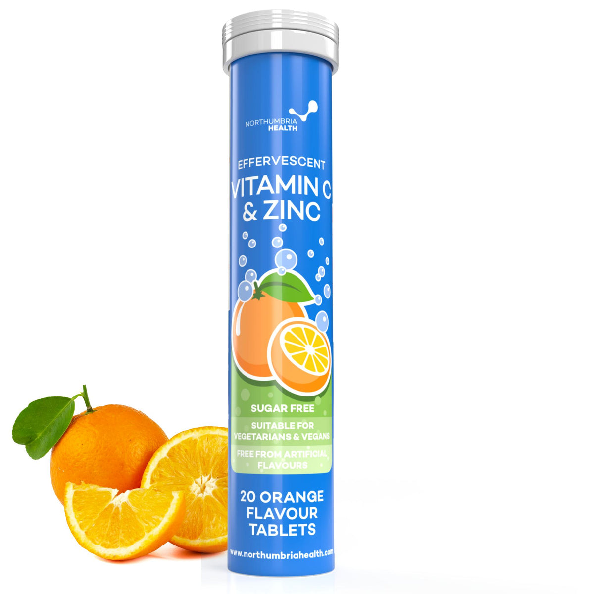 Northumbria Health blue tube of effervescent Vitamin C and Zinc tablets next to fresh oranges