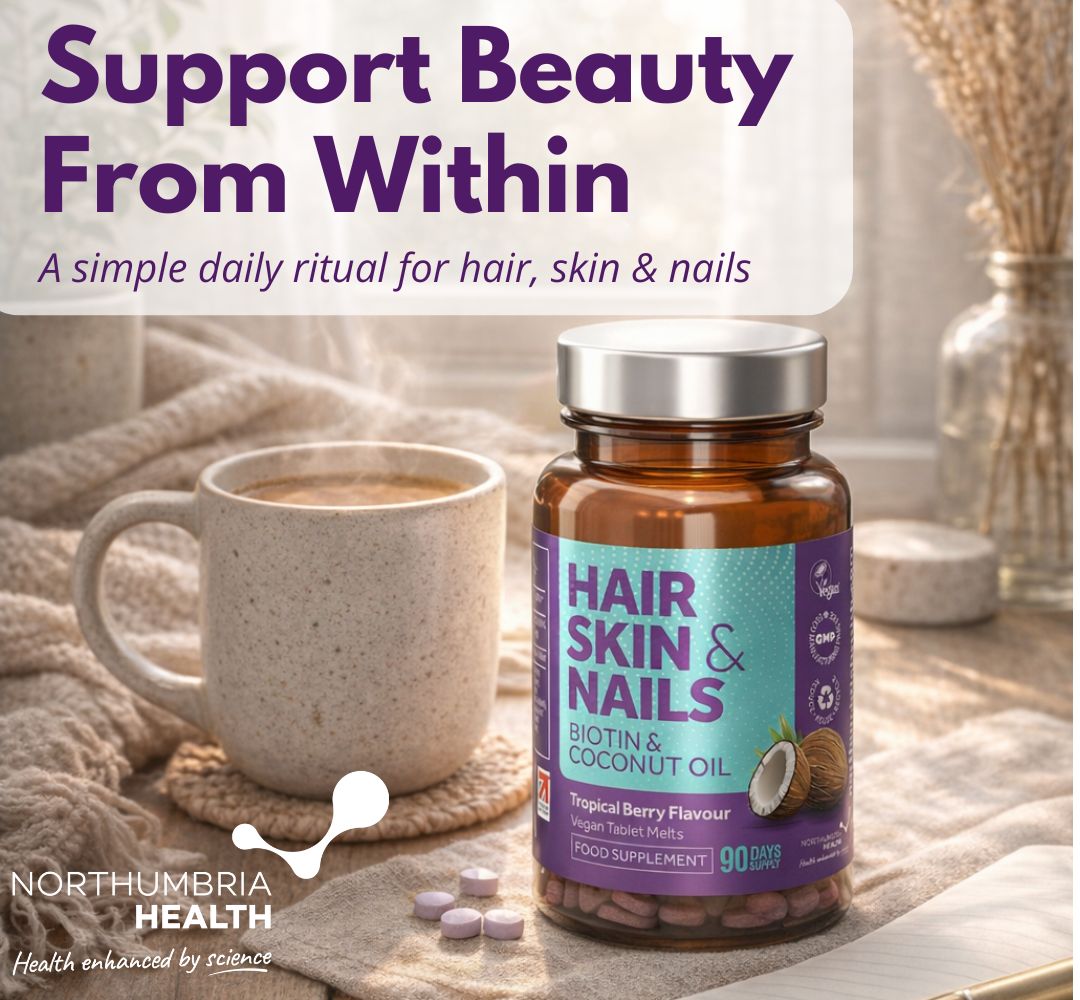 Northumbria Health Hair, Skin & Nails biotin bottle next to a warm mug of tea.