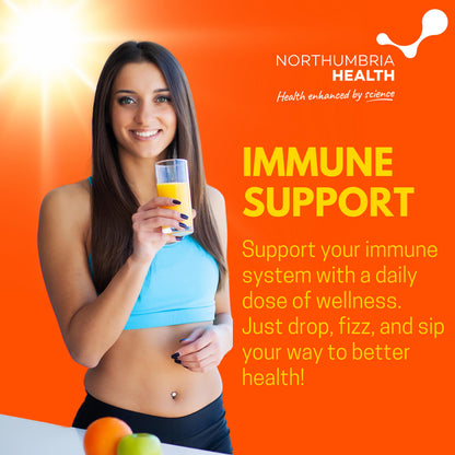 Woman holding orange immune support drink on a bright orange background.