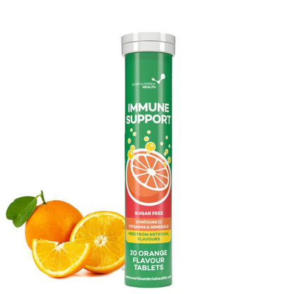 Northumbria Health Immune Support effervescent tablet tube next to fresh orange slices.