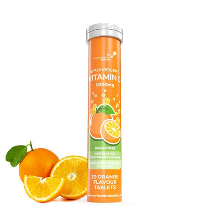 Northumbria Health Effervescent Vitamin C 1000mg tube next to fresh orange slices.
