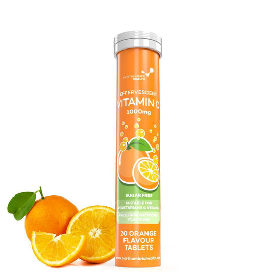 Northumbria Health Effervescent Vitamin C 1000mg tube next to fresh orange slices.