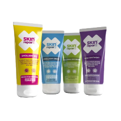 Four skincare tubes from skin repair2 standing upright on a white reflective surface against a white background. The tubes are yellow, light blue, light green, and purple, labeled Emollient Lotion, Emollient Cream, Day Cream, and Ointment respectively.
