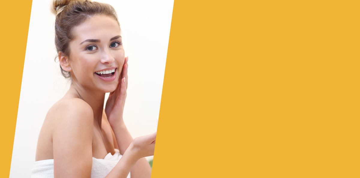 Woman with a radiant smile against a yellow background