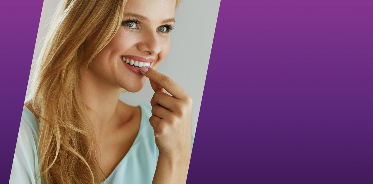 Woman with a smile on a purple background