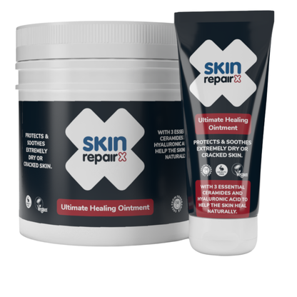 SkinRepairX Ultimate Healing Ointment in a white jar and black squeeze tube with blue and red branding on a white background.