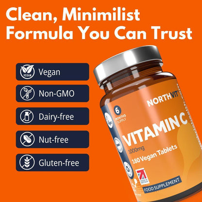 Northvit Vitamin C 1000mg bottle with 180 vegan tablets on an orange background.