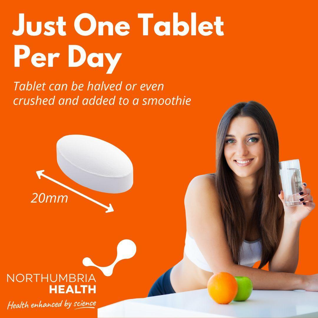 White 20mm Vitamin C tablet on orange background with a woman holding a glass of water.